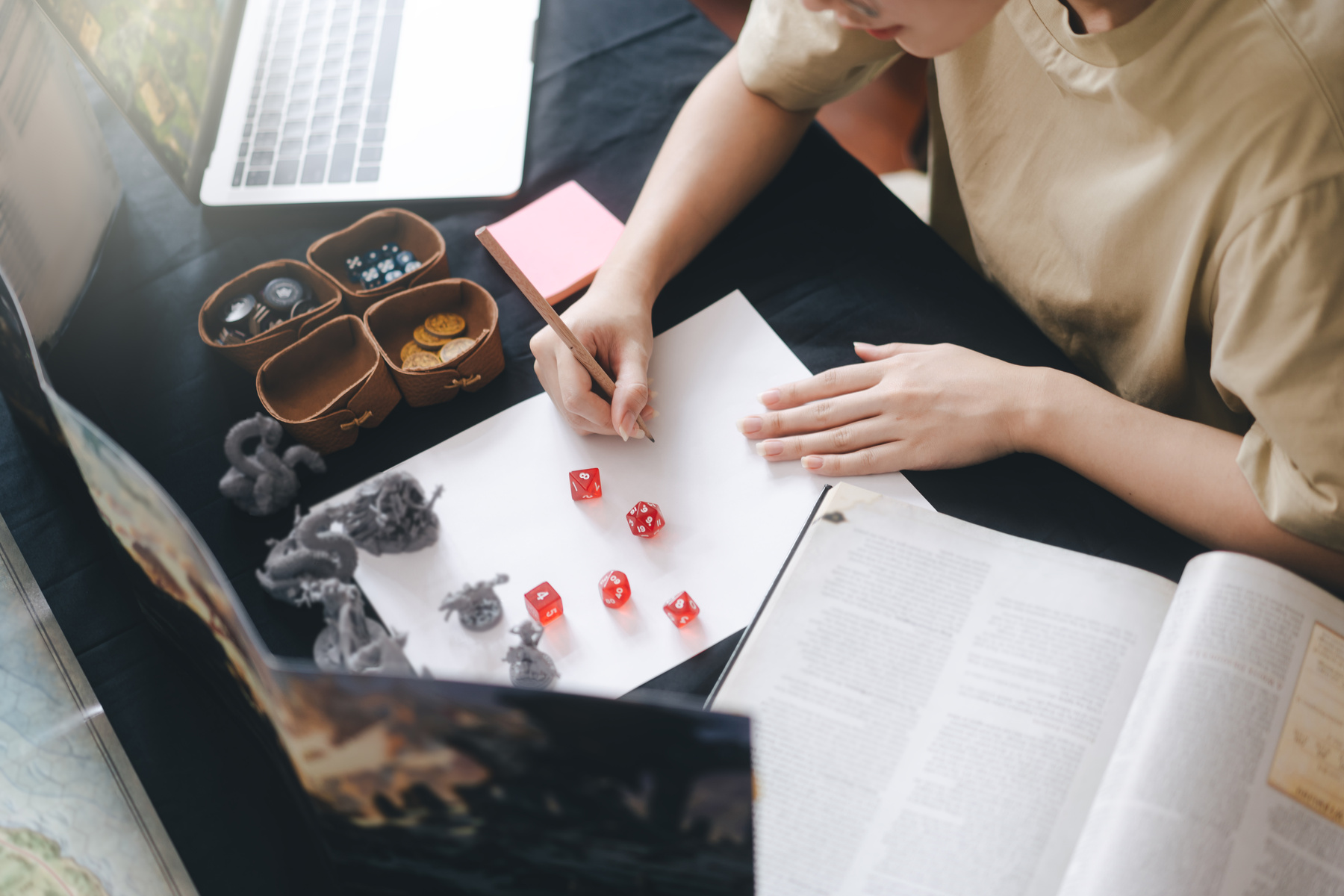 Woman hand writing for create story setup adventure role playing